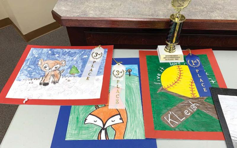L-R: Primary school winners first-grader Kinslie Brundage, first-grader Raina Caxwell, and second-grader K’Leigh Jones. BAILEY BALLARD/Staff