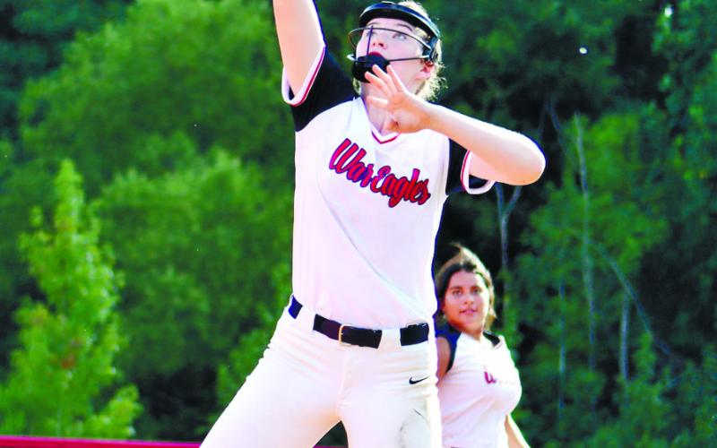 Sam Spisak gets tall while keeping toe on the bag for out at first.