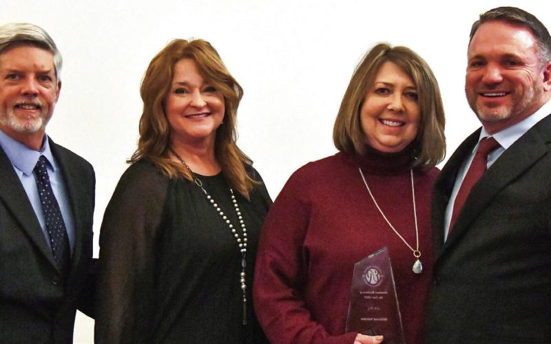 L-R: Robbie King and Amy McElhenney presented the Breakout Business of the Year Award to co-owners Paige and Tim Millwood. IAN TOCHER/Staff