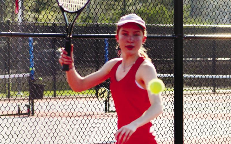 Hannah Erickson gets set to return a serve during a set point. ARELLA CASH/Staff