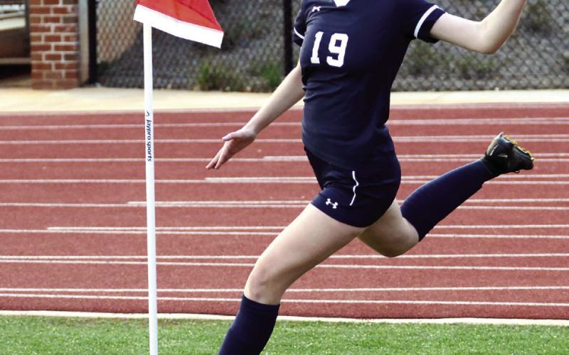 Putnam’s Elizabeth Haley (19) makes a corner kick toward the Westside-Augusta goal last Thursday night. IAN TOCHER/Staff