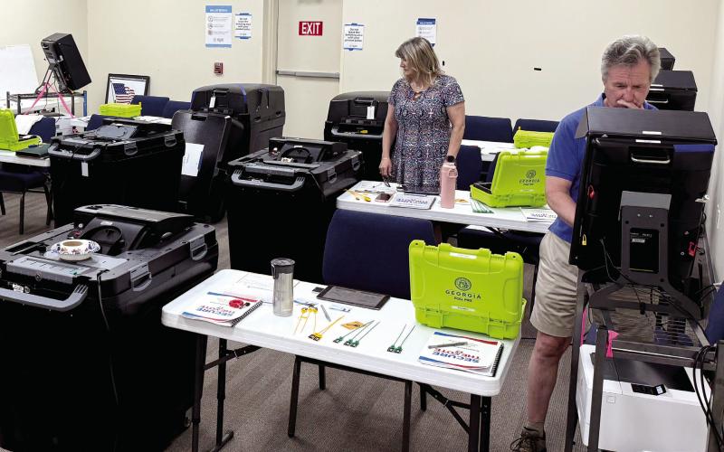 Under the watchful eye of Putnam County Elections Supervisor Kim Rudolph (not shown), three new local elections workers were receiving training last Friday afternoon at the county administration building. IAN TOCHER/Staff