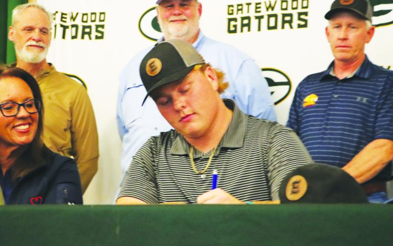 Gatewood Blake Daniel signs with Emmanuel College at a ceremony earlier this month. CONTRIBUTED