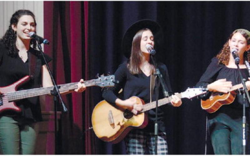 Sisters Helen, Elisa and Lily Garcia-Carreras of Evergreene perform on The Plaza stage. IAN TOCHER/Staff