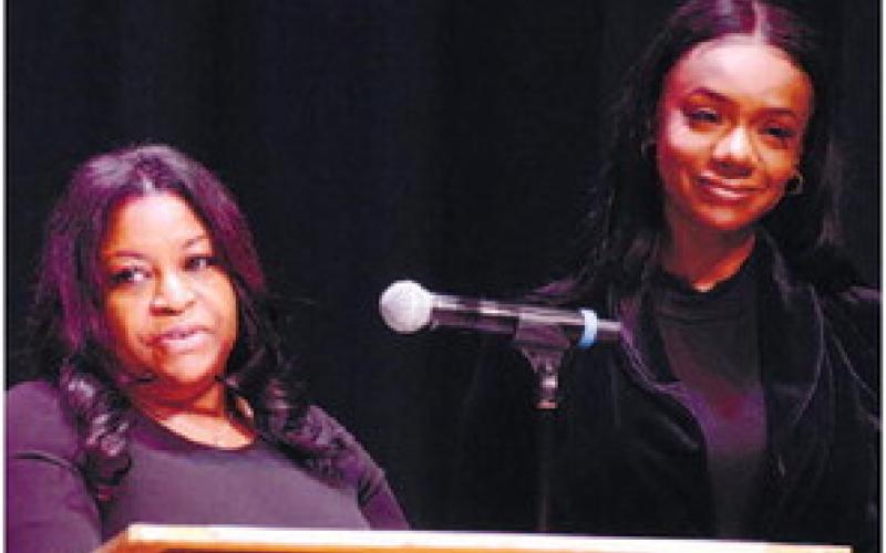 The “two Kims” LaRue (left) and Farley of Peaceful Purpose Hospice briefly took to the stage Dec. 14, during their Diamonds in the Sky event. IAN TOCHER/Staff