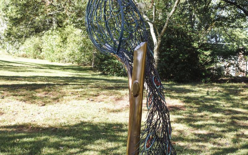 Carl the peacock perches on a limb peering at passersby. Carl is one of Melito’s favorite sculptures because of the importance of the peacock to author Flannery O’Connor and her home in Milledgeville. BAILEY MCCULLY/Staff