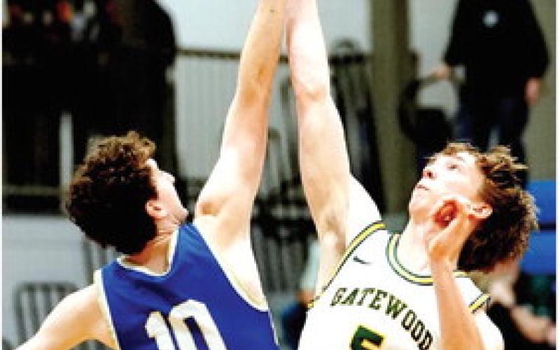 Gatewood senior Blake Callaway (5) won the opening tipoff Feb. 21 against Brentwood’s Harris McClarin in the state quarterfinals game in Macon. BOB BETZEL/Contributed
