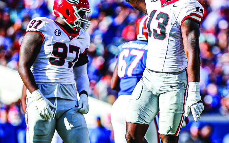 Georgia defensive linemen Warren Brinson (97) and Mykel Williams (13) in last year’s game against the Gators. KARI HODGES/UGAAA