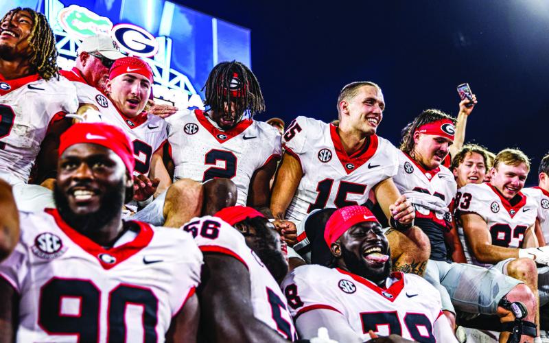 Bulldogs celebrate last year’s 43-20 win in Jacksonville. KARI HODGES/UGAAA
