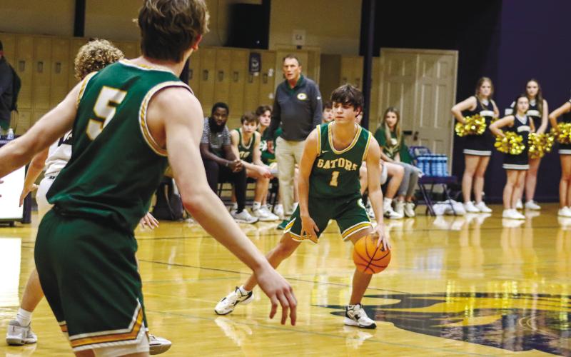 Jackson Morris (1) dribbles the ball at the top of the key in the loss to Westminster Christian last Tuesday. LANCE McCURLEY/Staff