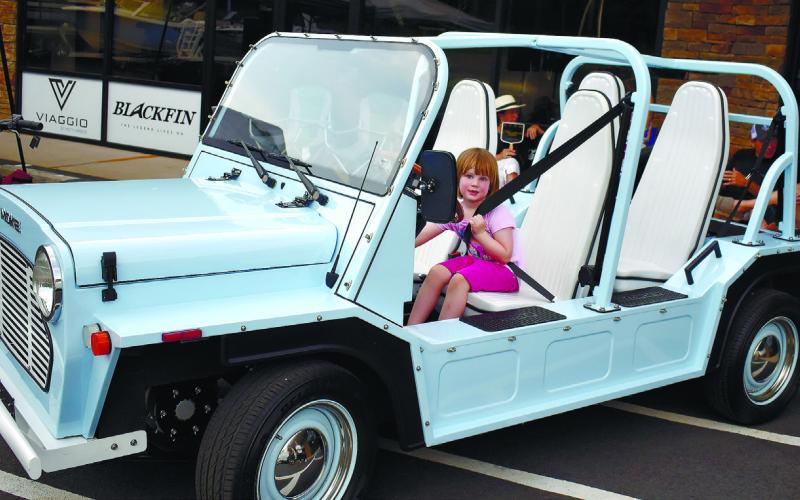 Gabby Pressley explores the Moke, just one of the electric vehicles available as a rental from Ride.