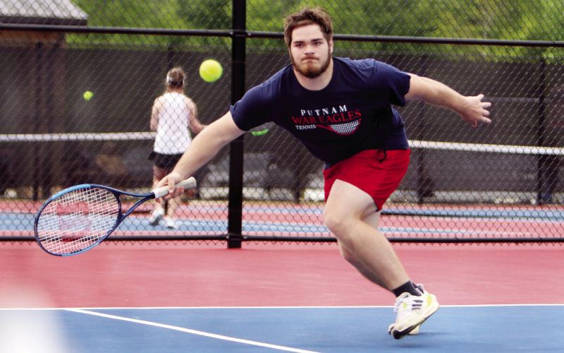 Putnam County's Tristan Williams extends his body for a ball in last week's match against Cook. (LANCE MCCURLEY/Staff)