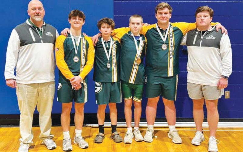 Gatewood wrestling head coach Tyler VanDusen (left) is understandably proud of the accomplishments of his state championshipcontending team of Jackson Hewatt, Huck McLaulin, Hunter Pierce, and Tyler Middleton. CONTRIBUTED