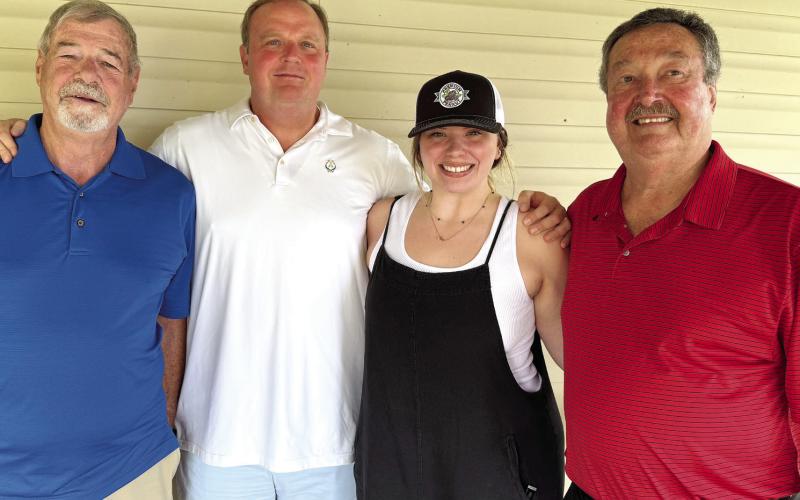 L-R: Trumpeter Col. Larry McClendon, Georgia Bulldogs broadcaster Jeff Dantzler, singer Katie Berry Moody, and event organizer Larry Edwards. IAN TOCHER/Staff