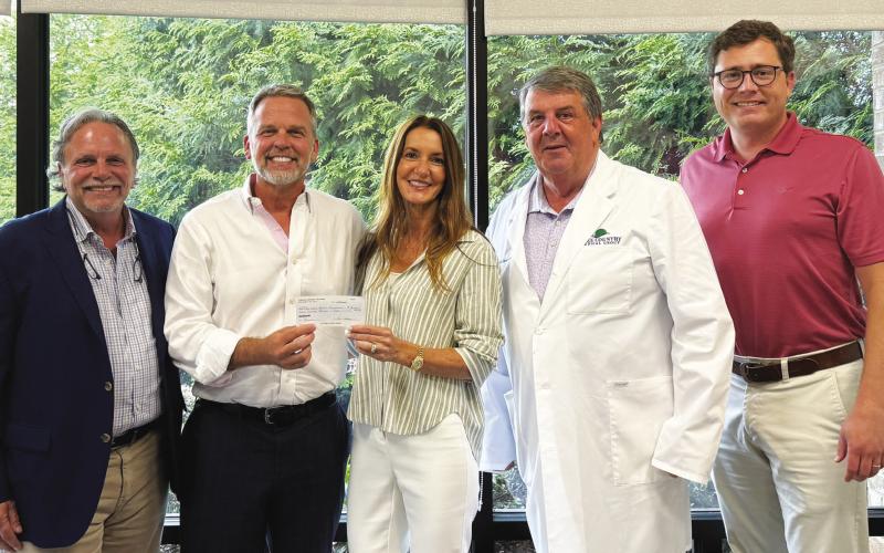 LCCHF Event Coordinator Tom Hanscom (above, l-r) presented an $8,000 check to Dr. David Bradley, Dr. Patti Bradley, LCCHF Medical Director Dr. Nicolas Chronos, and VP of Operations for LC Medical Group RJ Brooks on behalf of the Spencer Bradley Foundation for Mental Health. CONTRIBUTED