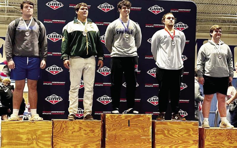 Tyler Middleton (farthest right) placed fifth overall in the  heavyweight division. CONTRIBUTED