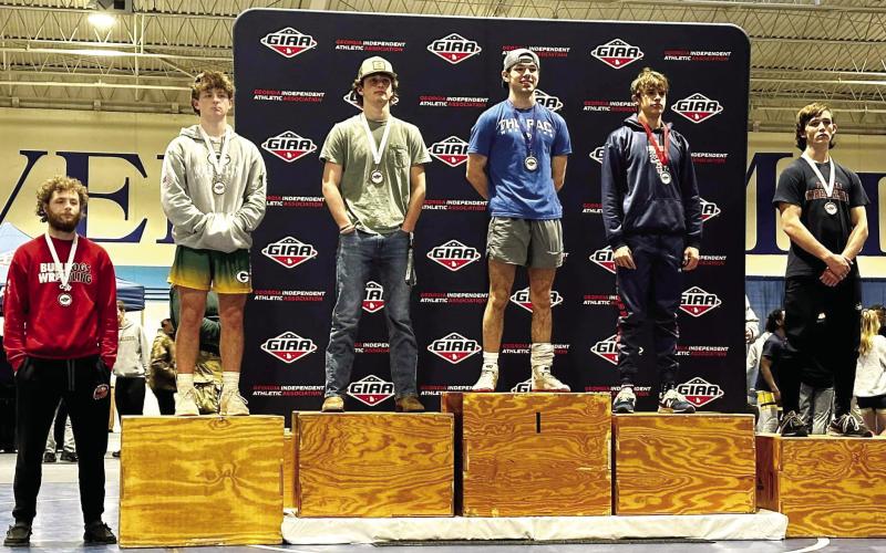Jackson Hewatt (second from left) placed fourth overall in the 144-point weight class. CONTRIBUTED