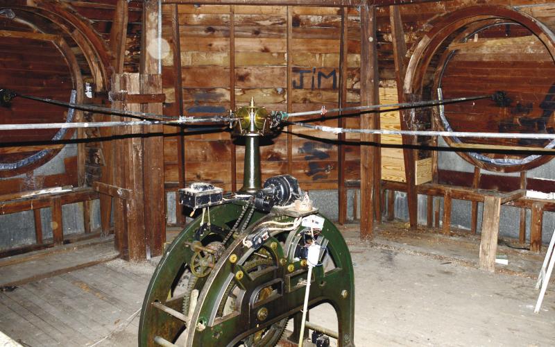 The clock mechanism in the dome atop the historic Putnam County Courthouse sends its timekeeping to the hands of four clock faces via the horizontal rods in the top half of the image. IAN TOCHER/Staff