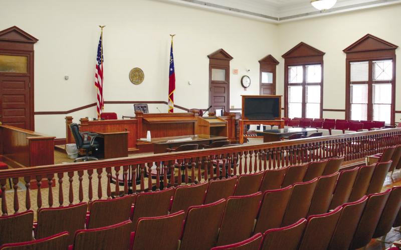 The primary Putnam County courtroom features a combination of old and modern. The judge’s bench, railings and all other woodwork dates back to 1905, while the gallery chairs and HVAC ducts at the top of the walls are much more recent additions. IAN TOCHER/Staff