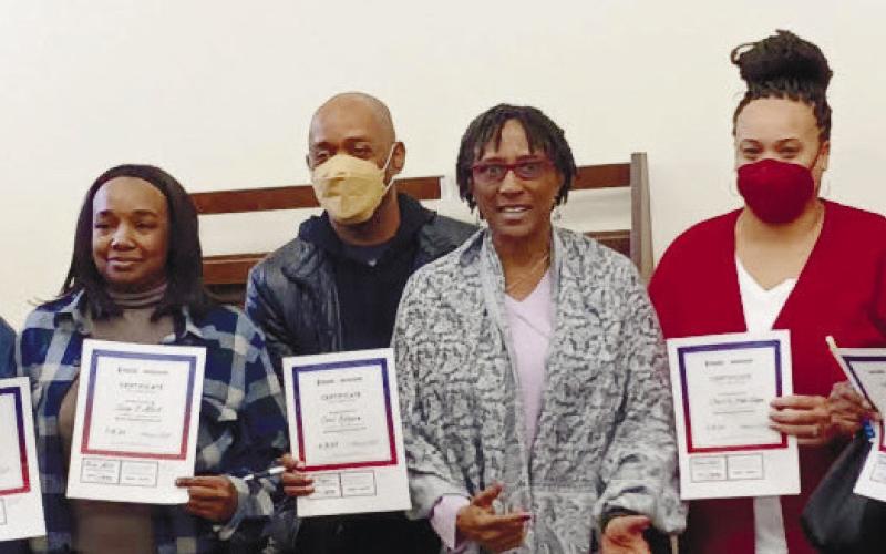 Event organizer Paula Moreland (far left) and instructor Dr. Rakale Quarells (center, in glasses) accompany successful students after they received two-year certifications as seizure responders from the Epilepsy Foundation and Emory University. CONTRIBUTED