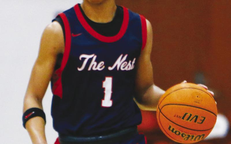 Putnam County junior Jeremy Banks (1) is the team’s third-leading scorer through 25 games, averaging 11 points a contest. LANCE McCURLEY/Staff