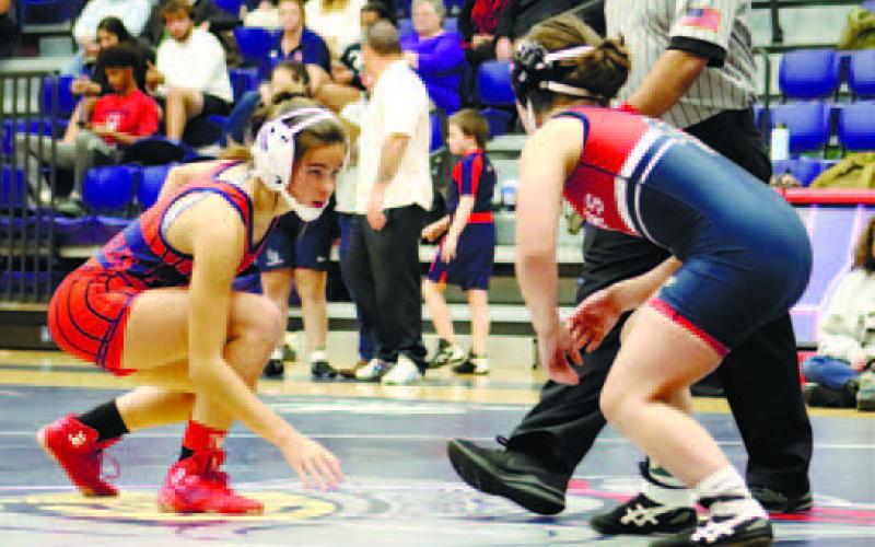 Lily Frisch starts her match against a Lamar County opponent. ARELLA CASH/Staff
