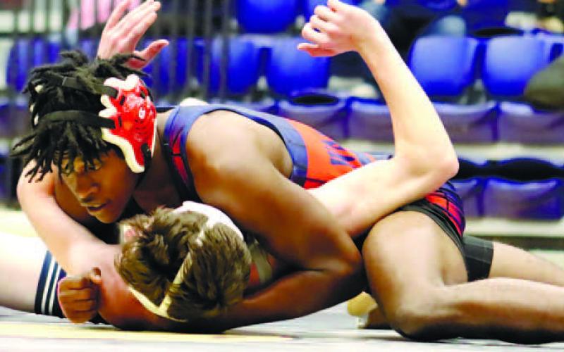 Brayon Farley pins his opponent for a win. ARELLA CASH/Staff