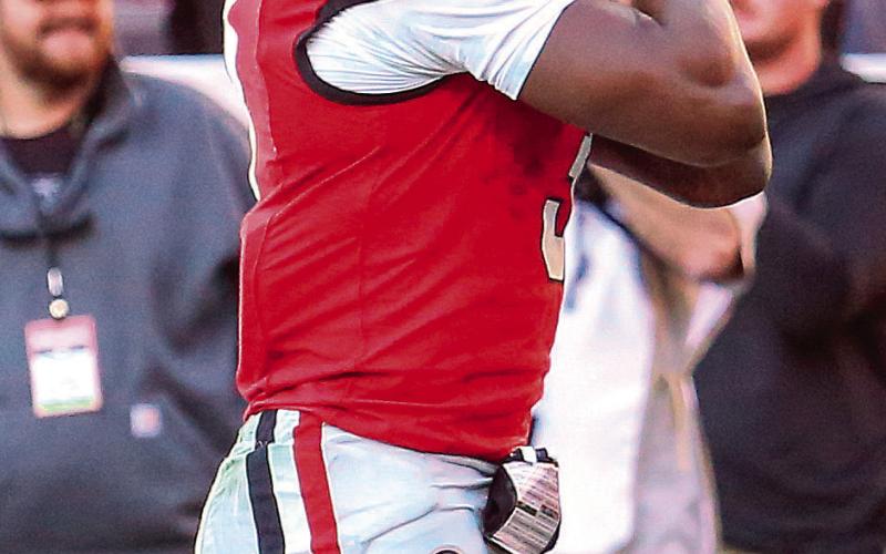 Georgia freshman running back Nate Frazier (3) carried the ball 21 times for 136 yards and three scores against the Massachusetts Minutemen. JIM TURNER/Contributed