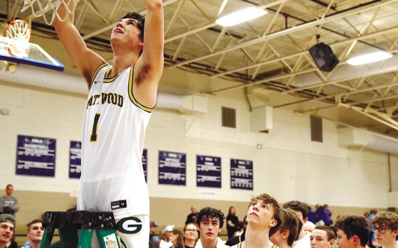 Gatewood senior Jackson Morris (1) cuts down a piece of a net after the Gators stomped Brentwood Academy to win the district title last Friday. BOB BETZEL/Contributed