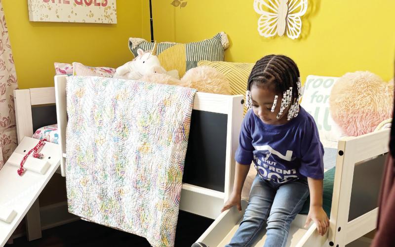 I’Keirra’s young daughter was delighted with her brand-new bedroom, made complete with a slide attached to her bed.  EMME CLAUSE/Staff