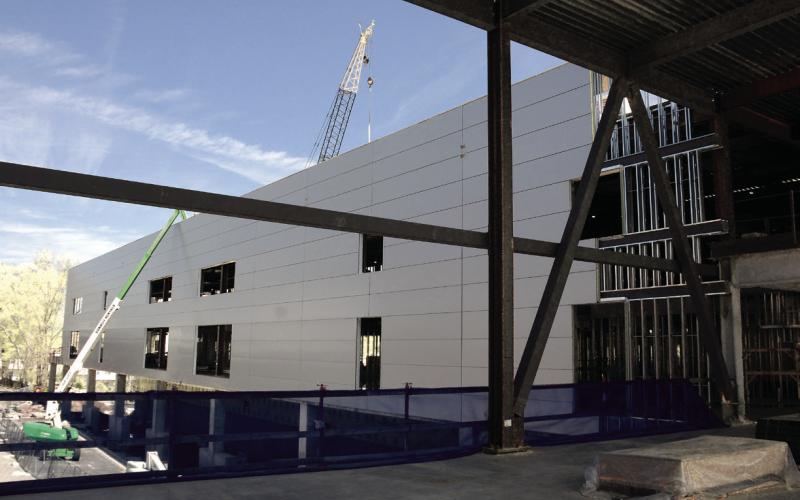 Upon completion, an enclosed walkway will connect the new arena with the main Classic Center building on the opposite side of Foundry Street in Athens.