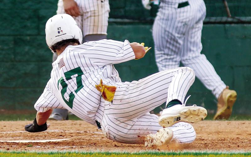 Jackson Hewatt (27) reaches for home plate to score for Gatewood against Westwood last Friday evening. TREY NORRIS/Staff