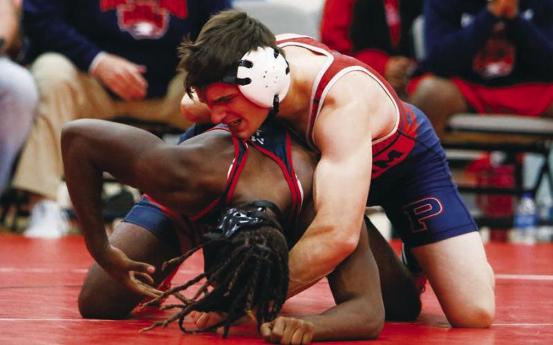 Putnam County’s Wyatt Suggs attempts to bring his opponent down on the mat. CONTRIBUTED
