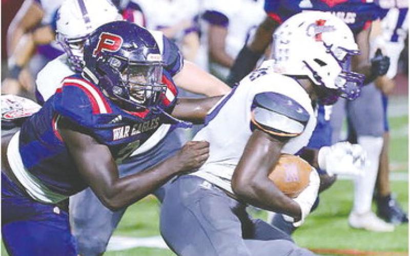 Rashod Daniel makes a tackle on Jasper County running back Chevy Sands. IAN TOCHER/Staff