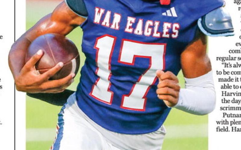 Putnam County running back Rasha Ellison breaks loose for a big gain during the War Eagles’ 24-21 scrimmage win over West Laurens on Friday night. LANCE McCURLEY/Staff