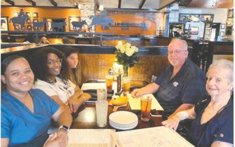 Joining Peaceful Purpose Hospice patient Beatrice Towers at Longhorn Steakhouse was her son Johnny Meeks (right) sitting opposite of Ms. Towers’ granddaughter, PPH social worker Brandiss Marks, and Porsha Smith of PPH (left front). CONTRIBUTED