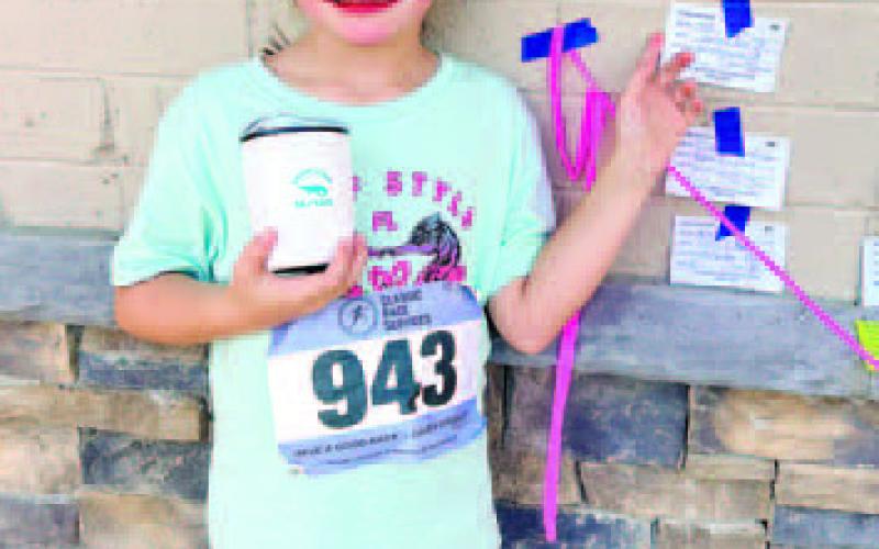 Young but fast: Eightyear- old, 2nd grader Bailey Ratliff, daughter of Gatewood’s football head coach Jeff Ratliff, scored the 8-and-under Swamp Stomp 5K title, with a time just 10 minutes behind overall winner Cale Ferguson. Bowie King, 11, a Gatewood 6th grader, won the overall and girls’ portion of the pre-race 2K Fun Run held on school property, while 9-year-old Daniel Robbins was the boys’ Fun Run winner. JEFF RATLIFF/Contributed