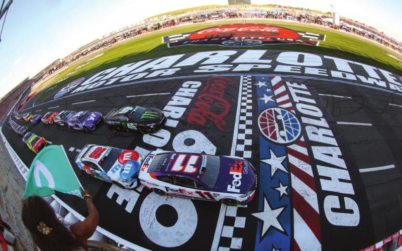 Denny Hamlin, driver of the #11 FedEx Ground Toyota, leads the field to the green flag to start the Cup Series Coca-Cola 600 at Charlotte Motor Speedway Sunday. After a wild double OT run, he’d be there for the checkered flag as well. (James Gilbert/Getty Images)