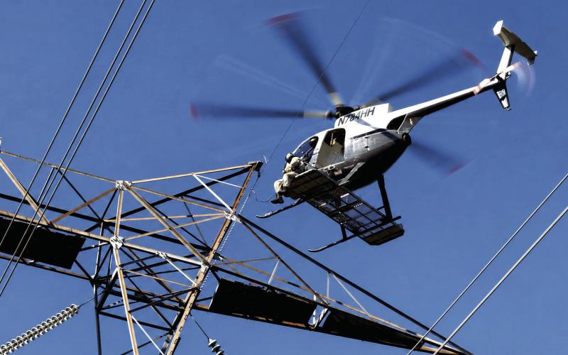 Georgia Power crews were busy conducting up-close inspections of high-voltage lines last week alongside Dennis Station Road in Putnam County. IAN TOCHER/Staff