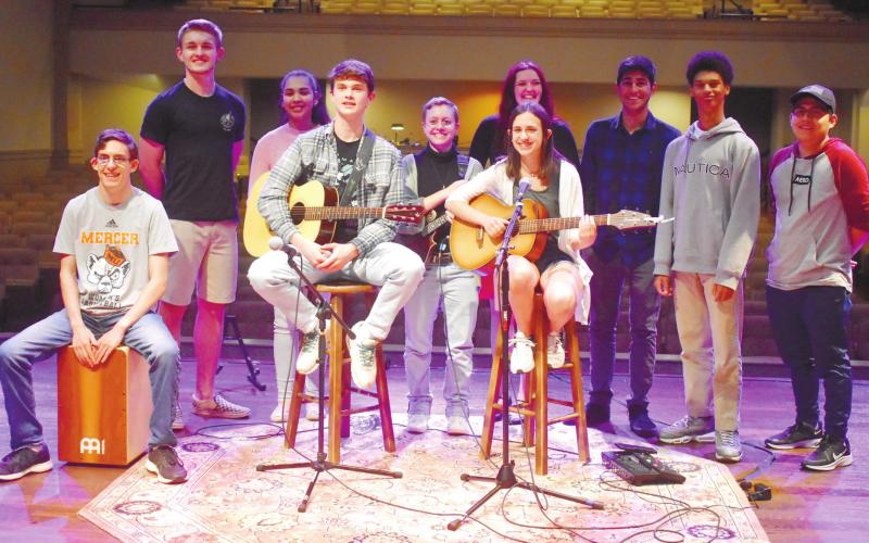 All performers and sound crew, for the third coffee house, came together to sing and close out the night. BAILEY BALLARD/Staff