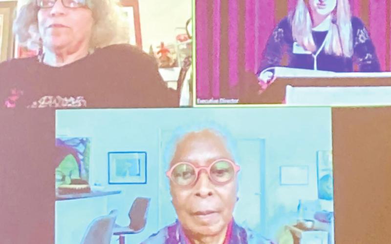 Dr. Beverly Guy-Shetfall, top left, GWM Director Melissa Swindell, top right, and Alice Walker, bottom, are seen via Zoom on the big screen at the Plaza. CONTRIBUTED