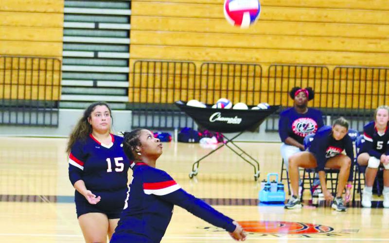 Outside hitter Tytianna Little (14) returns a returns a serve.