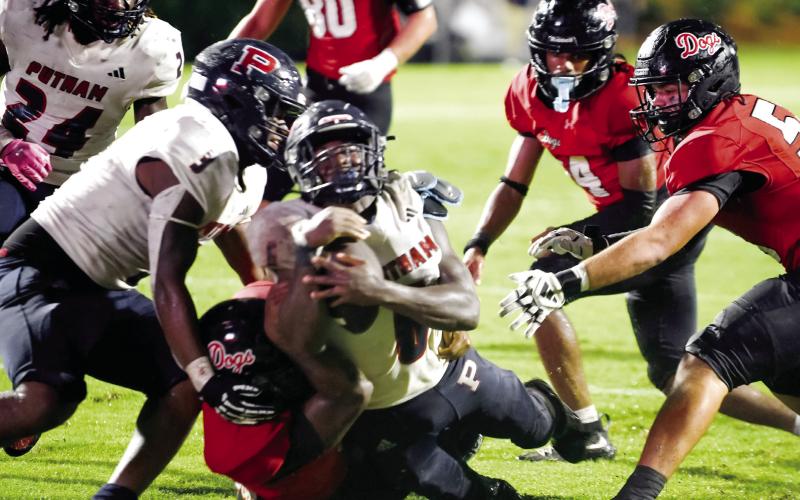 Putnam County senior running back Omarion Butts (6) dives across the goal line late in the second quarter as a Morgan County defender failed to bring him down. IAN TOCHER/Staff