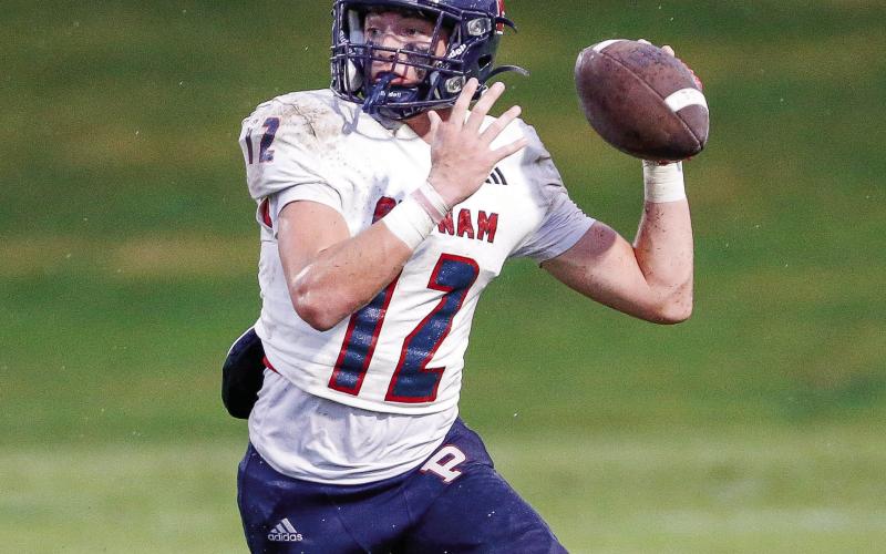 Putnam County senior quarterback Ethan Whatley drops back to pass. LANCE McCURLEY/Staff