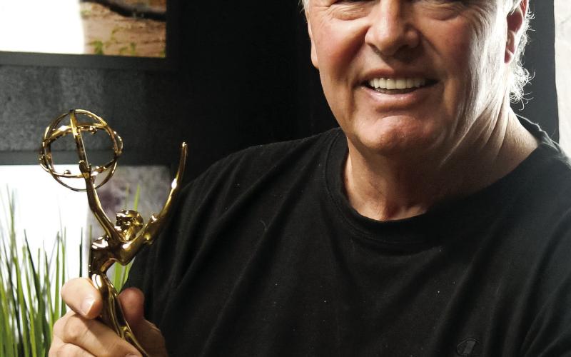 Jim Stone holds the Southeastern Emmy that Tytan Pictures received earlier this year for its “Timeless: 1929” production, shot in and around Eatonton with mostly local talent.  IAN TOCHER/Staff
