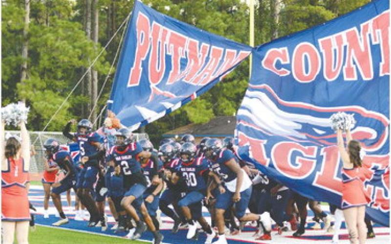 The War Eagles run out onto the field before their game against Jasper County on Friday. IAN TOCHER/Staff