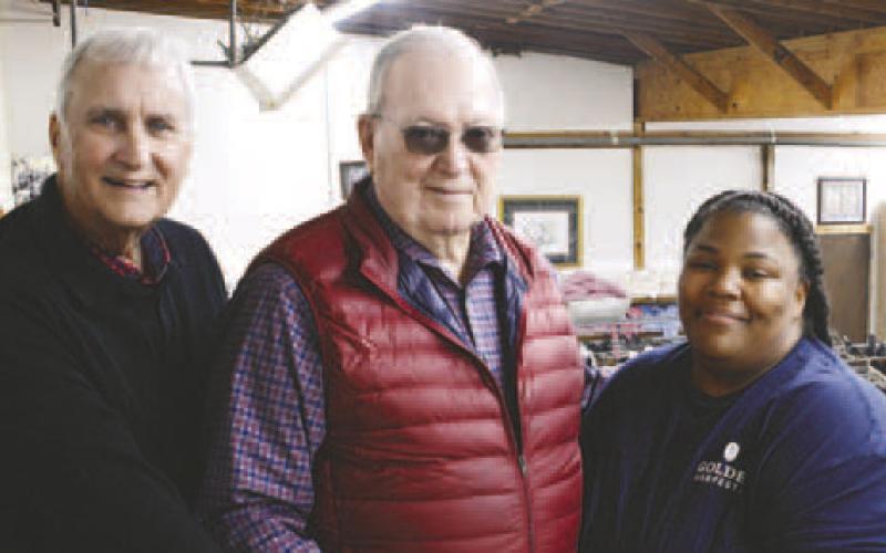 Putnam Christian Outreach (PCO) Chairman and acting Executive Director Rex Corlett (left) and PCO General Manager Linda Farley received a check from Geurry Key. CONTRIBUTED