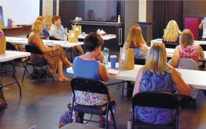 Andrea Cassell shares with workshop attendees what her experience of publishing her books was like. “We are not doing it to make money. We are doing it to make a di_erence,” she said.