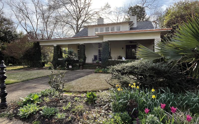 The WH Paul-Peeples house with its beautiful landscaping overtaking the front exterior view. CONTRIBUTED