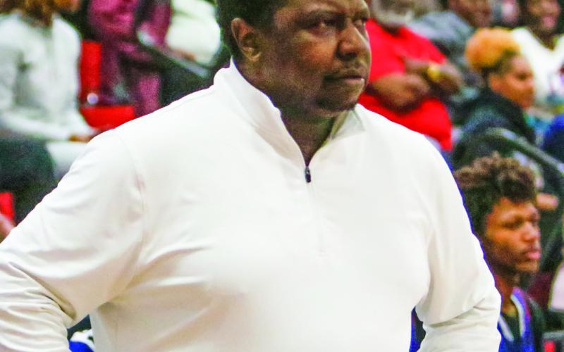 Putnam County boys basketball head coach Patrick Marshall watches his team from the bench in a game against Social Circle on Feb. 4. LANCE MCCURLEY/ Staff
